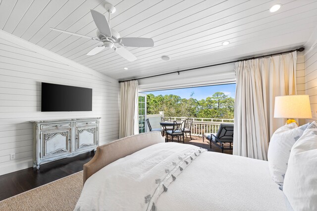 bedroom with dark hardwood / wood-style flooring, ceiling fan, and lofted ceiling