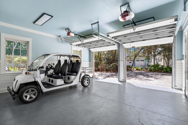 garage featuring a carport and a garage door opener