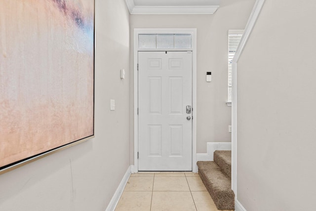 doorway featuring light tile floors and ornamental molding