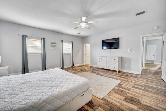 bedroom featuring ceiling fan and light hardwood / wood-style floors