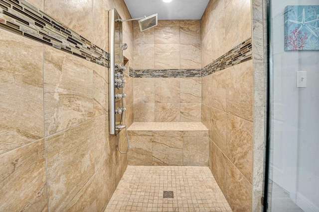 bathroom featuring tiled shower