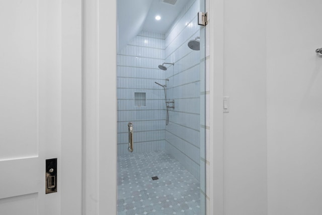 bathroom with tiled shower