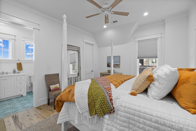 bedroom featuring ornamental molding, ceiling fan, sink, and light wood-type flooring