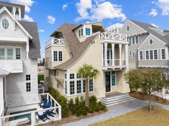 rear view of house with a balcony