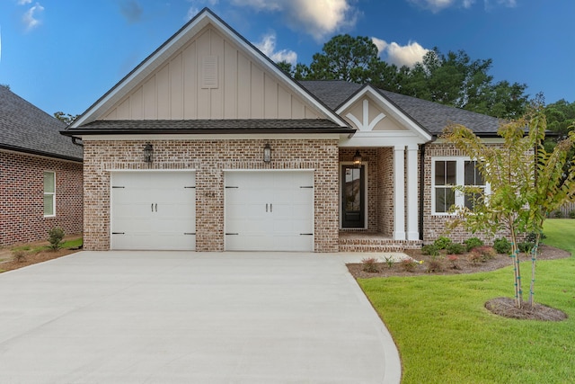 view of front of property with a garage and a front yard