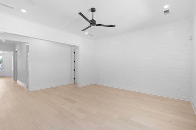 spare room featuring light wood-type flooring and ceiling fan