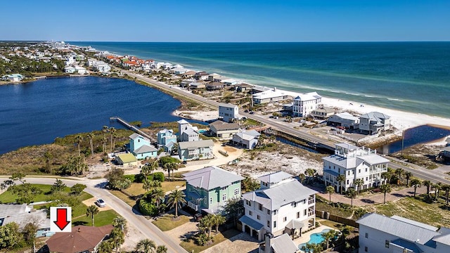 drone / aerial view featuring a view of the beach and a water view