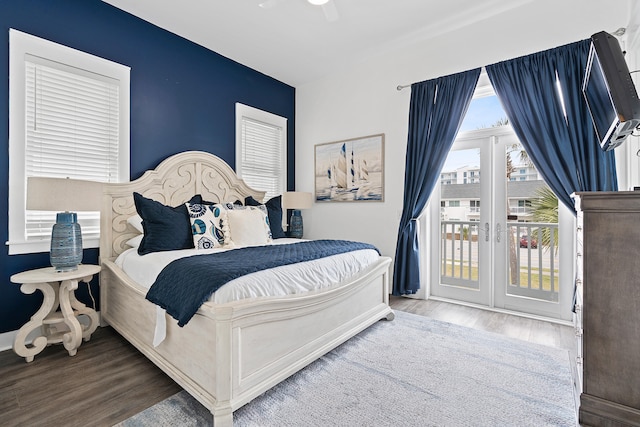 bedroom featuring hardwood / wood-style floors, access to outside, and ceiling fan