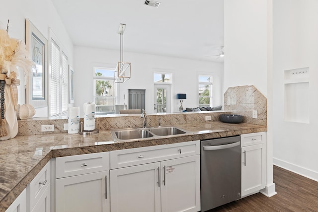 kitchen featuring dark wood-type flooring, white cabinetry, sink, and stainless steel dishwasher