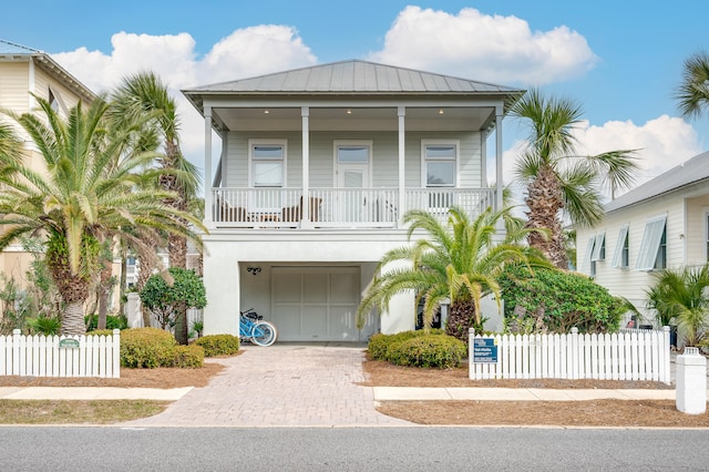 raised beach house with a garage