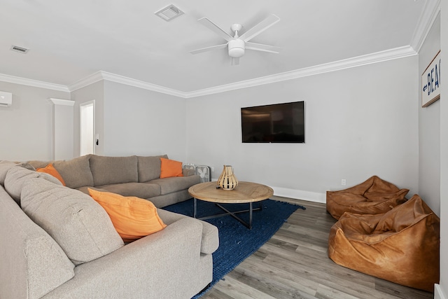 living room with ceiling fan, ornamental molding, and hardwood / wood-style flooring