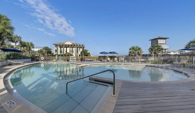 view of swimming pool featuring a wooden deck