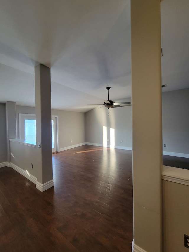 interior space featuring ceiling fan and dark wood-type flooring