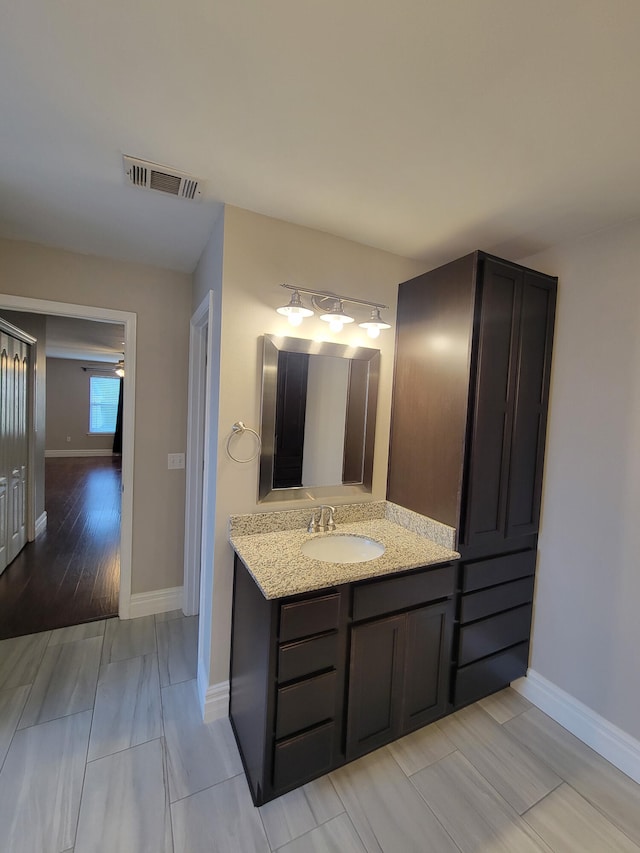 bathroom featuring tile patterned floors and vanity