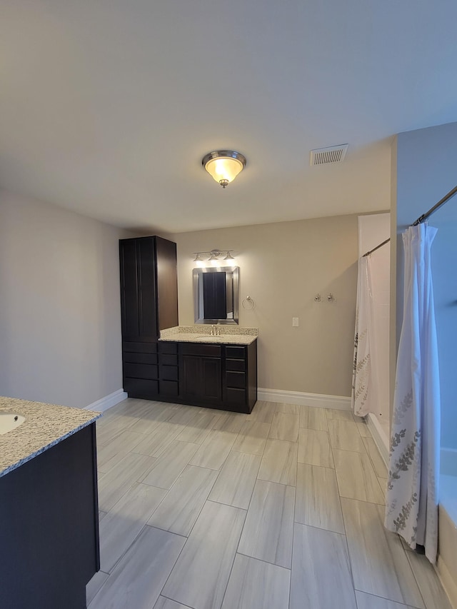 kitchen with sink and light stone counters