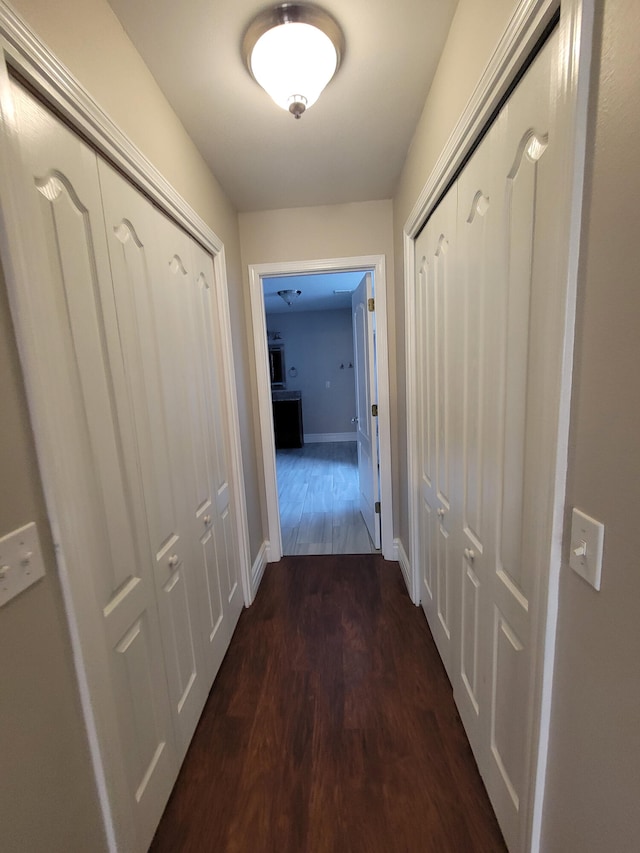 hallway featuring wood-type flooring