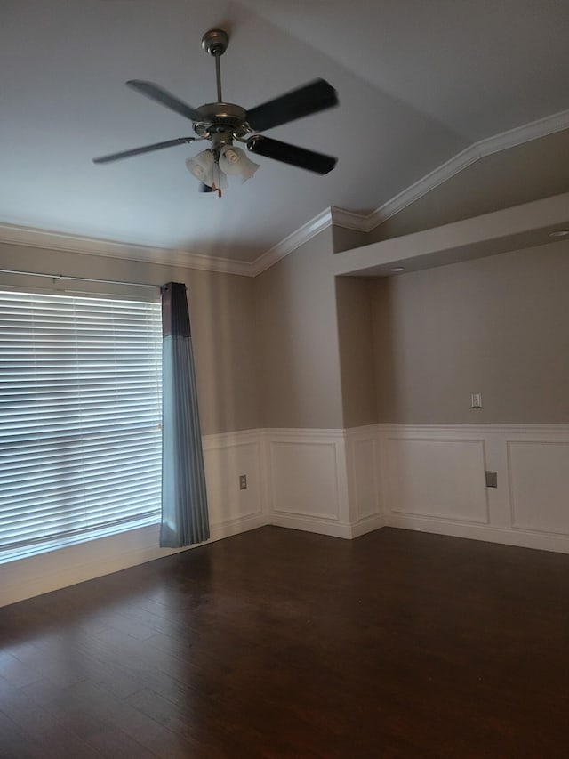 unfurnished room with ceiling fan, vaulted ceiling, wood-type flooring, and crown molding