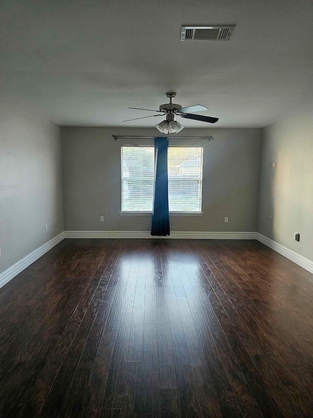 empty room featuring ceiling fan and wood-type flooring