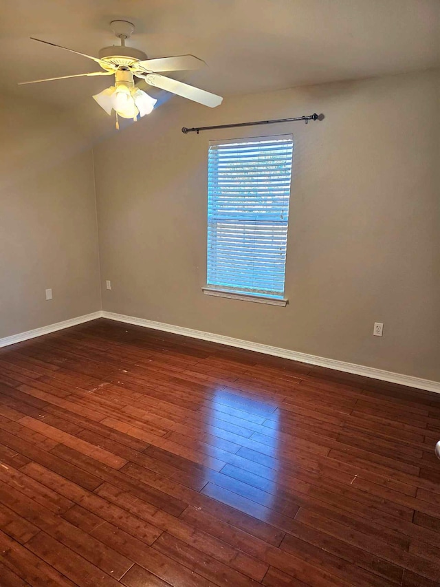 unfurnished room featuring dark hardwood / wood-style flooring and ceiling fan