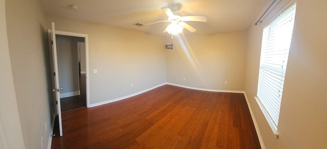 spare room featuring hardwood / wood-style floors and ceiling fan