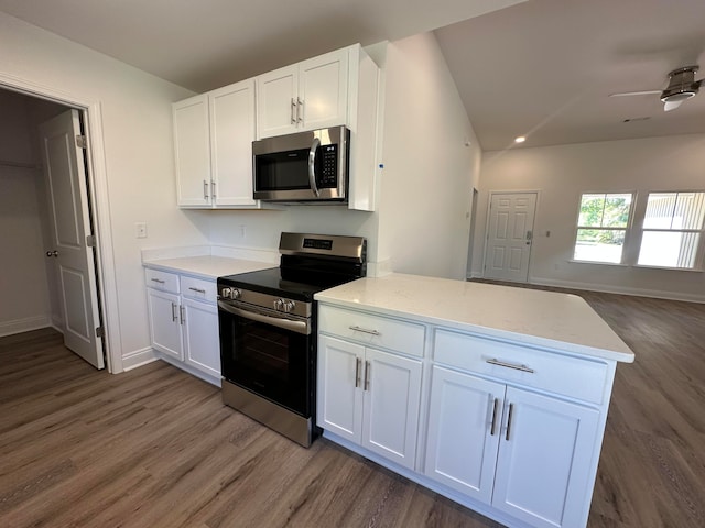 kitchen featuring ceiling fan, white cabinetry, dark wood-type flooring, and appliances with stainless steel finishes