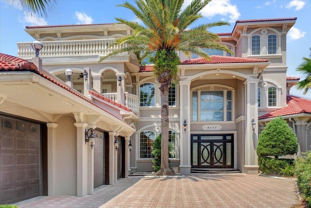 mediterranean / spanish-style home featuring a garage