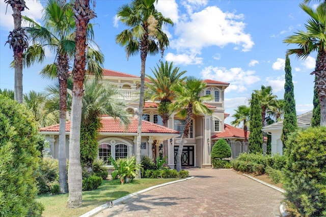 view of front of house featuring a balcony