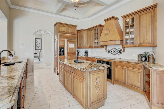 kitchen with premium range hood, black appliances, sink, coffered ceiling, and light stone countertops