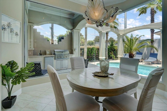 sunroom / solarium with ornate columns and sink