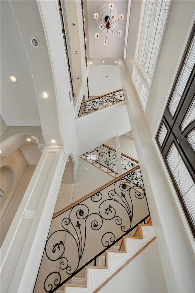 stairway with a towering ceiling