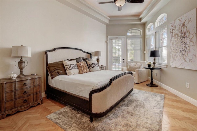 bedroom with a raised ceiling, access to outside, ceiling fan, light parquet floors, and crown molding