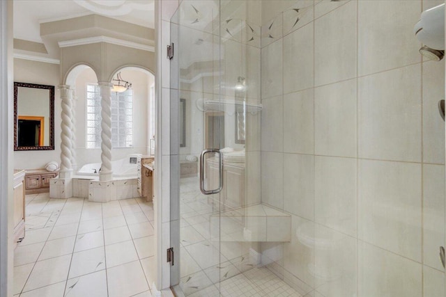 bathroom featuring tile patterned floors, vanity, crown molding, and separate shower and tub