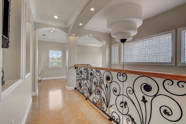 hallway featuring light parquet floors and crown molding