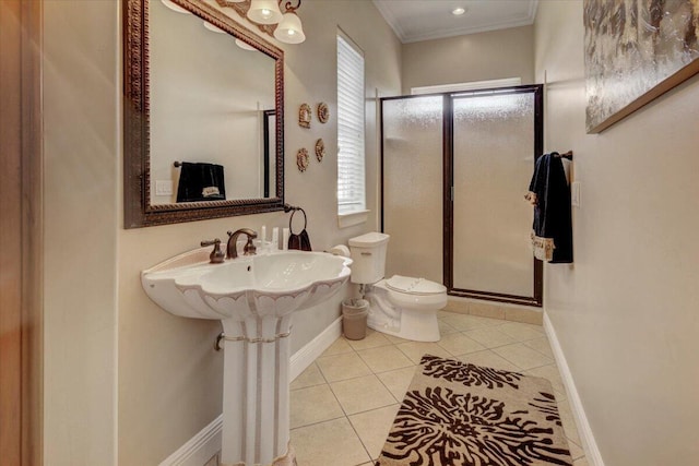 bathroom with toilet, tile patterned flooring, crown molding, and an enclosed shower