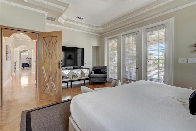 bedroom with access to outside, parquet floors, ornamental molding, and a raised ceiling