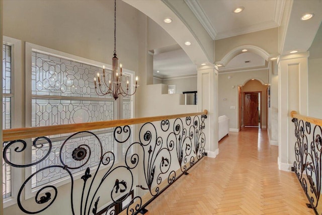 hall with ornamental molding and light parquet flooring