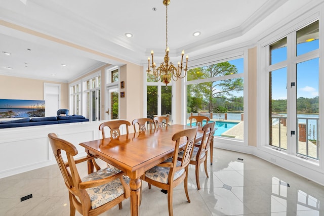 tiled dining area with ornamental molding and a notable chandelier