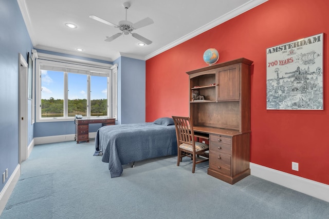 carpeted bedroom featuring ornamental molding and ceiling fan