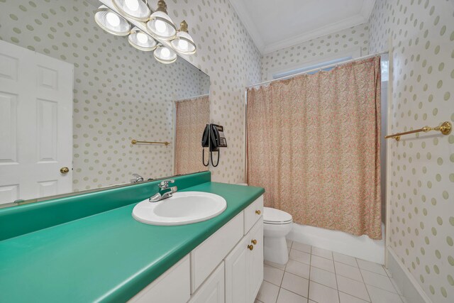 bathroom with crown molding, toilet, tile floors, and vanity