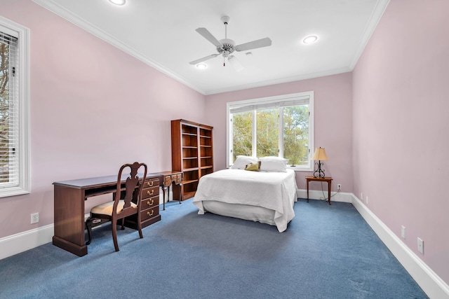 carpeted bedroom featuring ceiling fan and crown molding