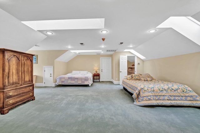 bedroom featuring carpet and vaulted ceiling with skylight