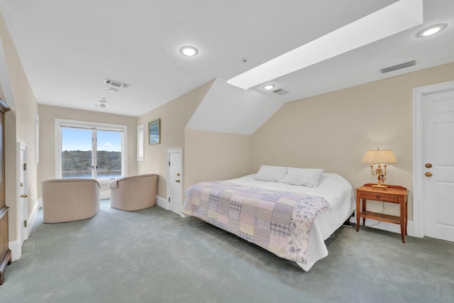 bedroom featuring lofted ceiling and carpet flooring