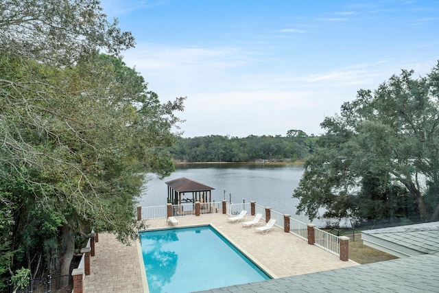 view of swimming pool featuring a water view and a gazebo