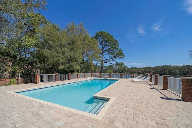 view of swimming pool with a patio area