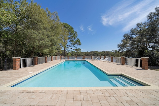 view of swimming pool featuring a patio