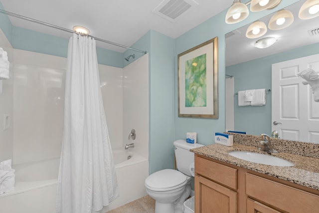 full bathroom with shower / bath combo with shower curtain, toilet, vanity, and tile patterned floors