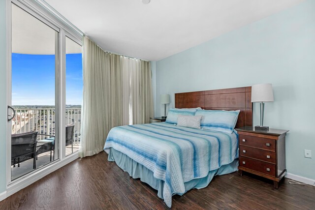 4203 Indian Bayou Trl Unit 1712, Destin, FL 32541 - bedroom with dark wood-style flooring, access to outside, a wall of windows, and baseboards
