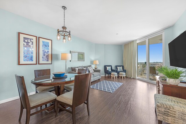 4203 Indian Bayou Trl Unit 1712, Destin, FL 32541 - dining room with a chandelier, dark wood finished floors, expansive windows, and baseboards