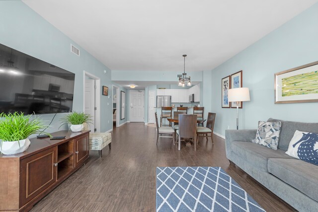 4203 Indian Bayou Trl Unit 1712, Destin, FL 32541 - living room featuring dark wood-style floors and baseboards
