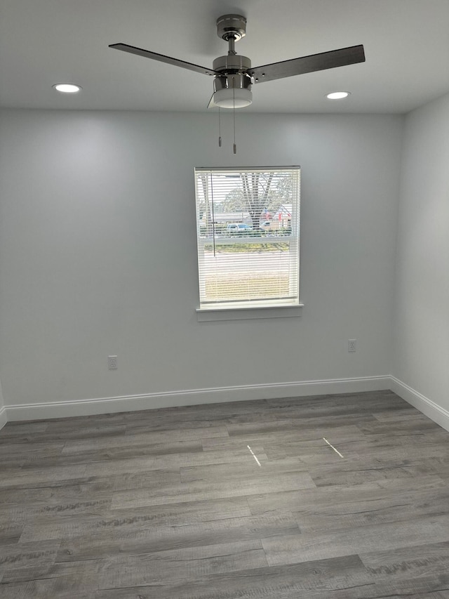 spare room with ceiling fan and light hardwood / wood-style floors